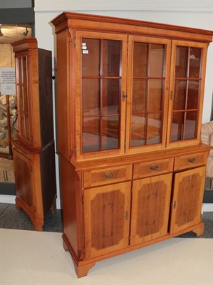 Lot 1282 - A yew wood veneered glazed bookcase, and a yew wood veneered glazed floor standing corner cupboard