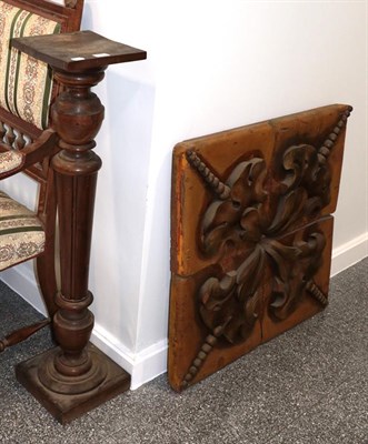 Lot 1289 - ~ A continental hardwood pedestal, 106cm high, together with a decorative carved relief wood panel