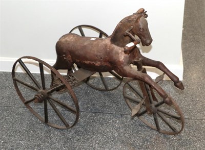 Lot 1290 - ~ A 19th century carved wooden and iron pedal horse