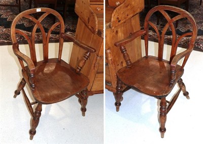 Lot 1296 - A pair of 19th century elm Windsor chairs (2)