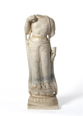 Lot 181 - A Chinese Carved Stone Torso of a Bodhisattva, possibly Tang Dynasty, standing hold a fruit, a...