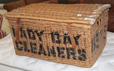 Lot 1313 - A wicker laundry basket, with stencil decoration, 78cm by 53cm