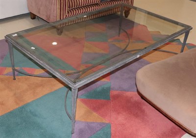 Lot 1314 - A wrought metal and glass coffee table, 150cm by 90cm