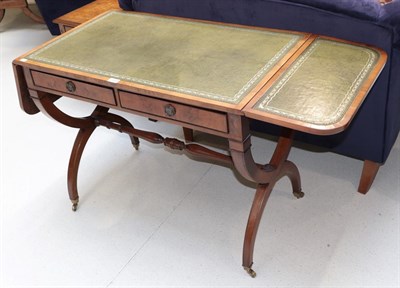 Lot 1326 - A reproduction leather inset sofa table fitted with two drawers, 93cm closed by 55cm by 72cm