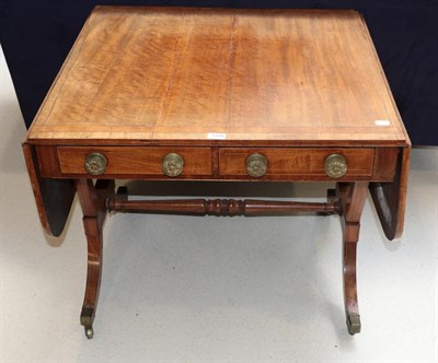 Lot 1328 - A 19th century crossbanded mahogany sofa table, 83cm closed by 77cm by 70cm (a.f.)