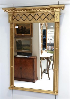 Lot 1334 - A Regency inverted breakfront mirror (later gilding)