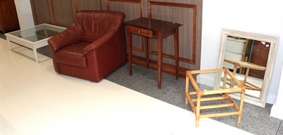 Lot 1335 - Modern items comprising a brown leather armchair; cream coffee table; painted cream mirror; a small