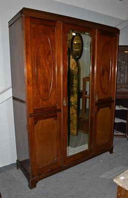 Lot 1338 - A Mahogany mirror fronted triple wardrobe