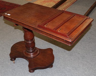 Lot 1340 - A 19th century mahogany adjustable writing stand, the rectangular top with moulded edge and lift up