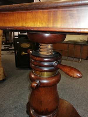 Lot 1340 - A 19th century mahogany adjustable writing stand, the rectangular top with moulded edge and lift up