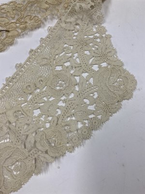 Lot 2031 - A Late 19th Century/Early 20th Century Cream Lace Cape, of decorative floral design with a...