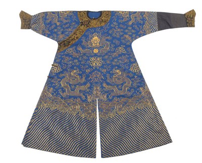 Lot 190 - A Chinese Dragon Robe, early 20th century, the indigo ground worked in gold wrapped threads...