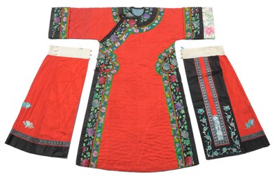 Lot 191 - A Chinese Silk Embroidered Winter Robe, early 20th century, with scarlet floral roundel...