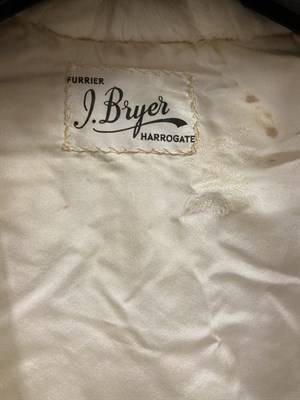 Lot 2064 - Circa 1950s J Bryer of Harrogate Ermine Evening Jacket, with long sleeves, collar and hung with...