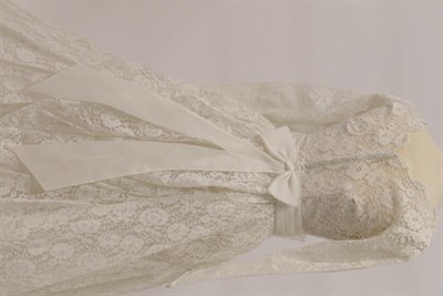 Lot 2072 - Three Early 20th Century Wedding Dresses, comprising a cream silk halter neck dress, woven with...