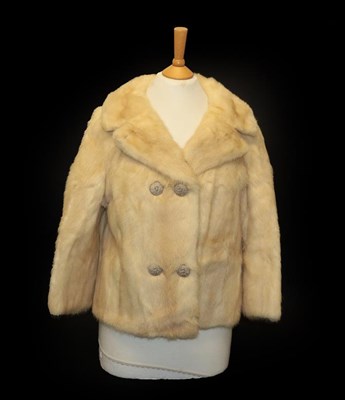 Lot 2080 - Maxwell Cowan York, Palomino Mink Short Double Breasted Evening Jacket, with three quarter...