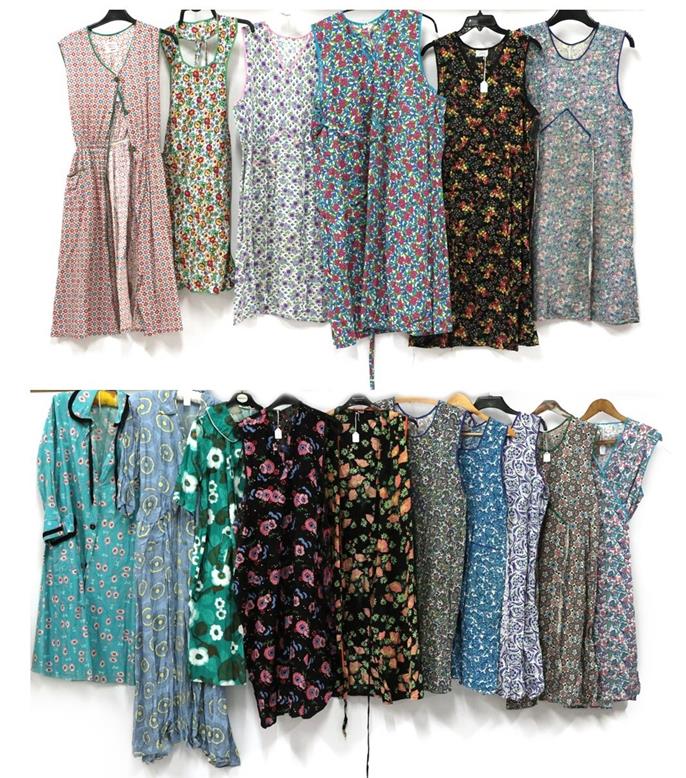 Lot 2093 - Thirteen Circa 1950s Printed Cotton Aprons of various designs, labels include Beech Tree,...