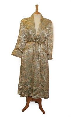Lot 2119 - 20th Century Chinese Cream Silk Robe, embroidered with peach and cream flower heads and applied...