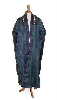 Lot 2124 - A 20th Century Afghan Purple and Green Striped Chapan, with floral lining similar to those worn...