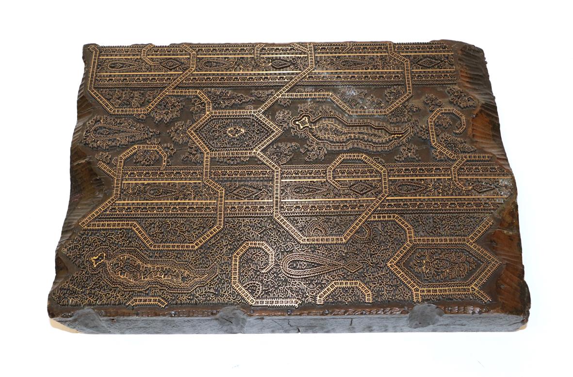 Lot 2157 - A 19th Century Wooden Cotton Printing Block, with a paisley style design, impressed to the...