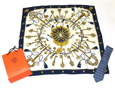 Lot 2172 - Hermes Silk Scarf 'Les Clefs' Design on cream with a navy border; and a Hermes Silk Tie on...