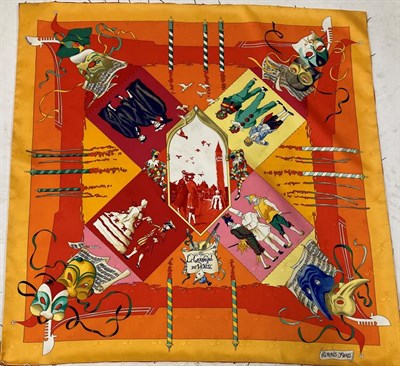 Lot 2179 - Hermes Silk Scarf 'Le Carnaval de Venise' depicting masked figures within an orange and yellow...