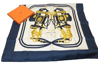 Lot 2181 - Hermes Silk Scarf 'Brides de Gala', on a white ground and navy border, 89cm square, in original box