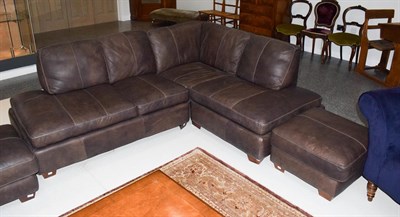 Lot 1331A - A brown leather corner settee with matching footstool, 230cm by 180cm