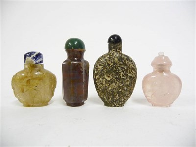 Lot 205 - A Chinese Chalcedony Panelled Octagonal Snuff Bottle, Qing Dynasty, with associated green stone...