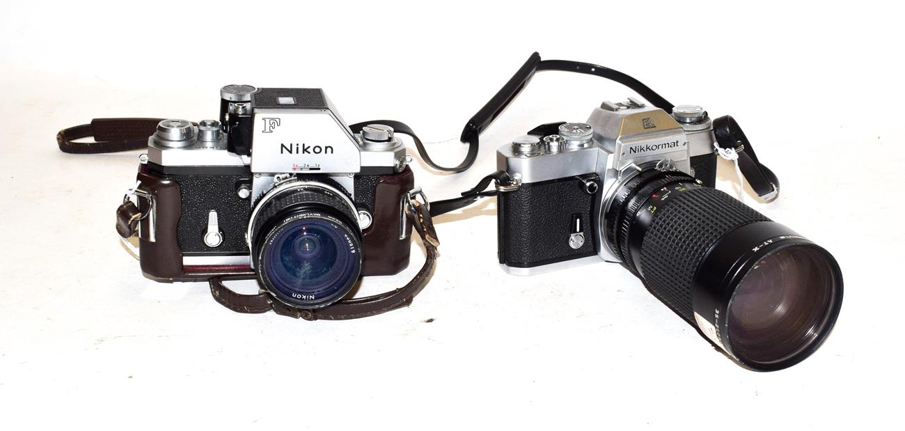 Lot 3097 - Nikon Two Cameras (i) F body no.6963665 with Nikkor f2.8 24mm lens (ii) Nikkormat EL no.5286766...