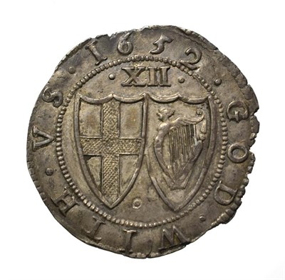 Lot 4003 - The Commonwealth, 1652 Shilling. 5.91g, 32.1mm, 9h. Obv: Shield with English arms. Rev: Shields...