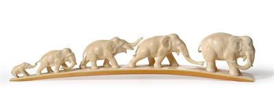 Lot 232 - A Japanese Carved Elephant Ivory Elephant Bridge Group, circa 1910, as a line of five graduated...