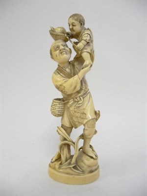 Lot 236 - A Japanese Ivory Okimono, Meiji period (1868-1912), of a man in traditional dress holding a...