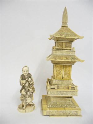 Lot 237 - A Japanese Ivory Okimono, Meiji period (1868-1912), of a man wearing loose robes holding a...