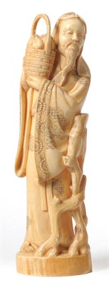 Lot 238 - A Japanese One Piece Carved Elephant  Ivory Figure of a Sage, circa 1910, the bearded and...