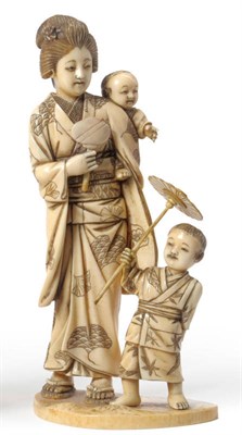 Lot 240 - A Japanese Carved Elephant Ivory Figure Group of a Lady and Two Children, Meiji period (1868-1912)