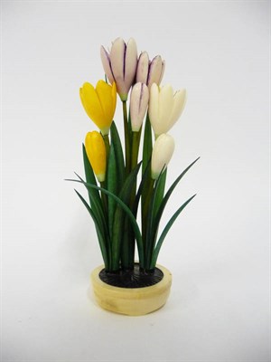 Lot 243 - A Japanese Stained Ivory Okimono, Meiji period (1868-1912), in the form of a spray of crocus...