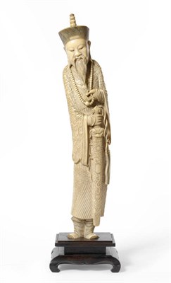 Lot 253 - A Chinese Carved Elephant Ivory Figure of the God of War, circa 1965, the behatted and bearded...
