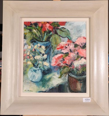 Lot 1054 - Anne Mendelow (b.1945) Study of red and white flowers in pots Signed, oil on canvas, 36.5cm by 32cm