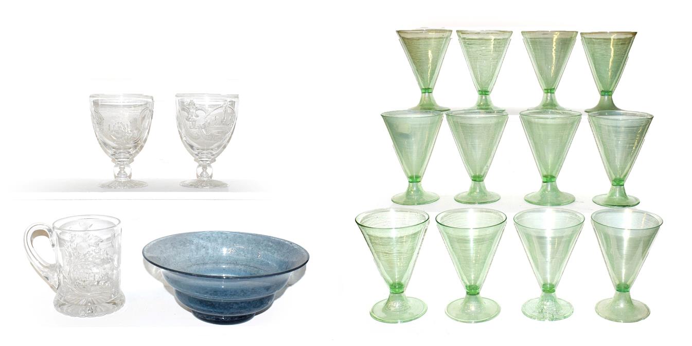Lot 1 - A set of twelve Continental green cocktail glasses, of trumpet form and each raised on folded foot