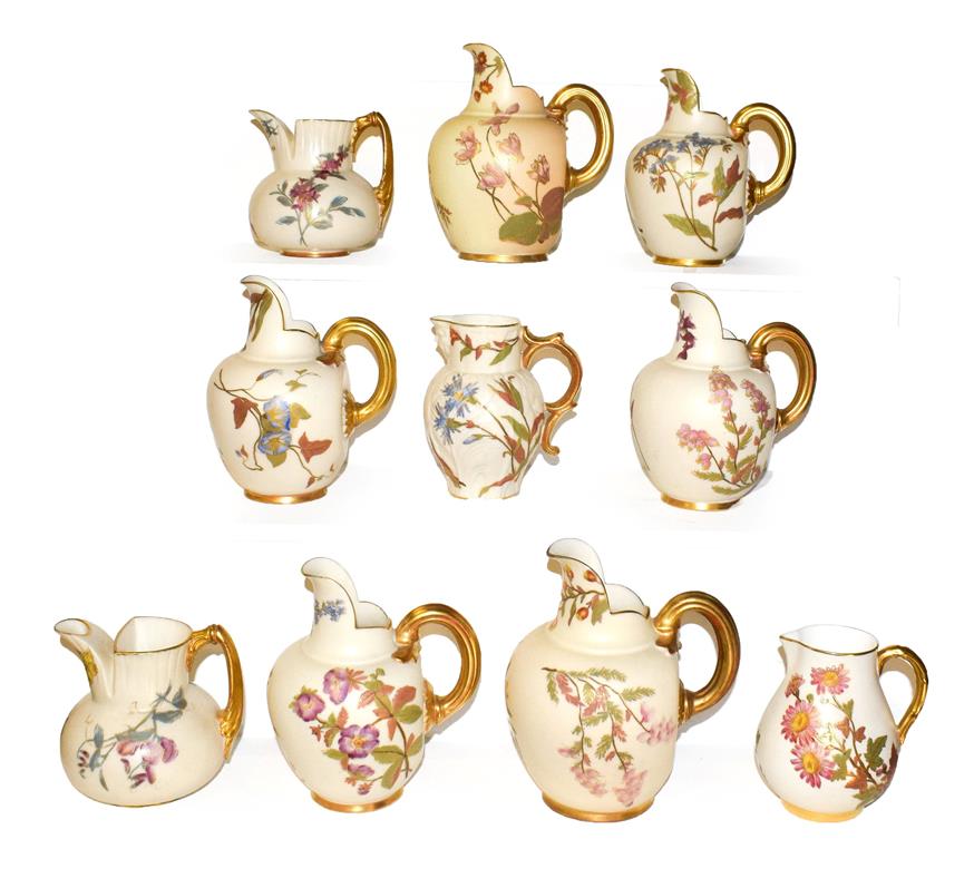 Lot 11 - Ten Royal Worcester blush ware jugs including Victorian, mostly flat back and also including a mask