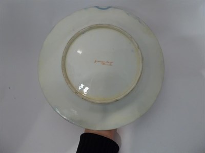 Lot 23 - A Royal Worcester powder blue ground plate with scalloped edge, painted by George Evans with a...