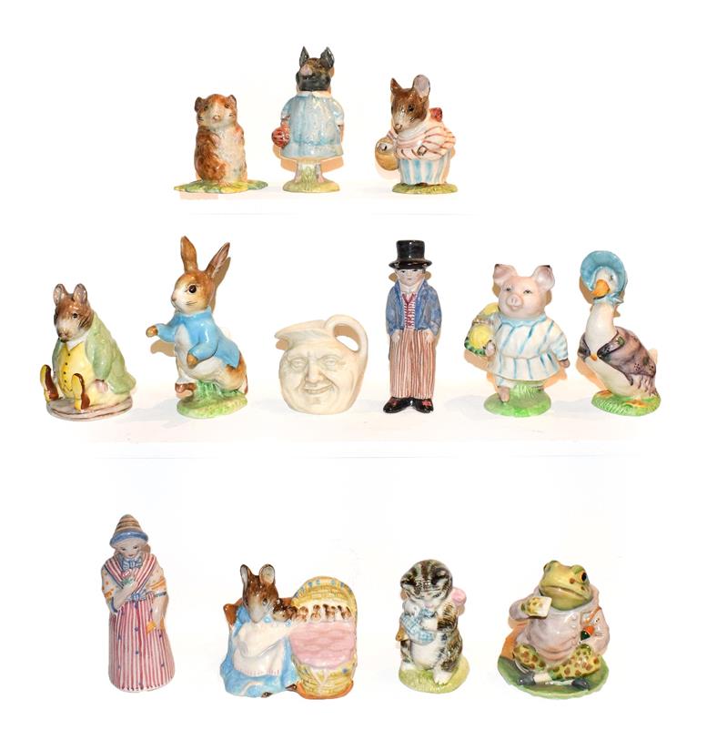 Lot 26 - Ten Beatrix Potter figures including some gold back stamps, Royal Doulton miniature jug and a...