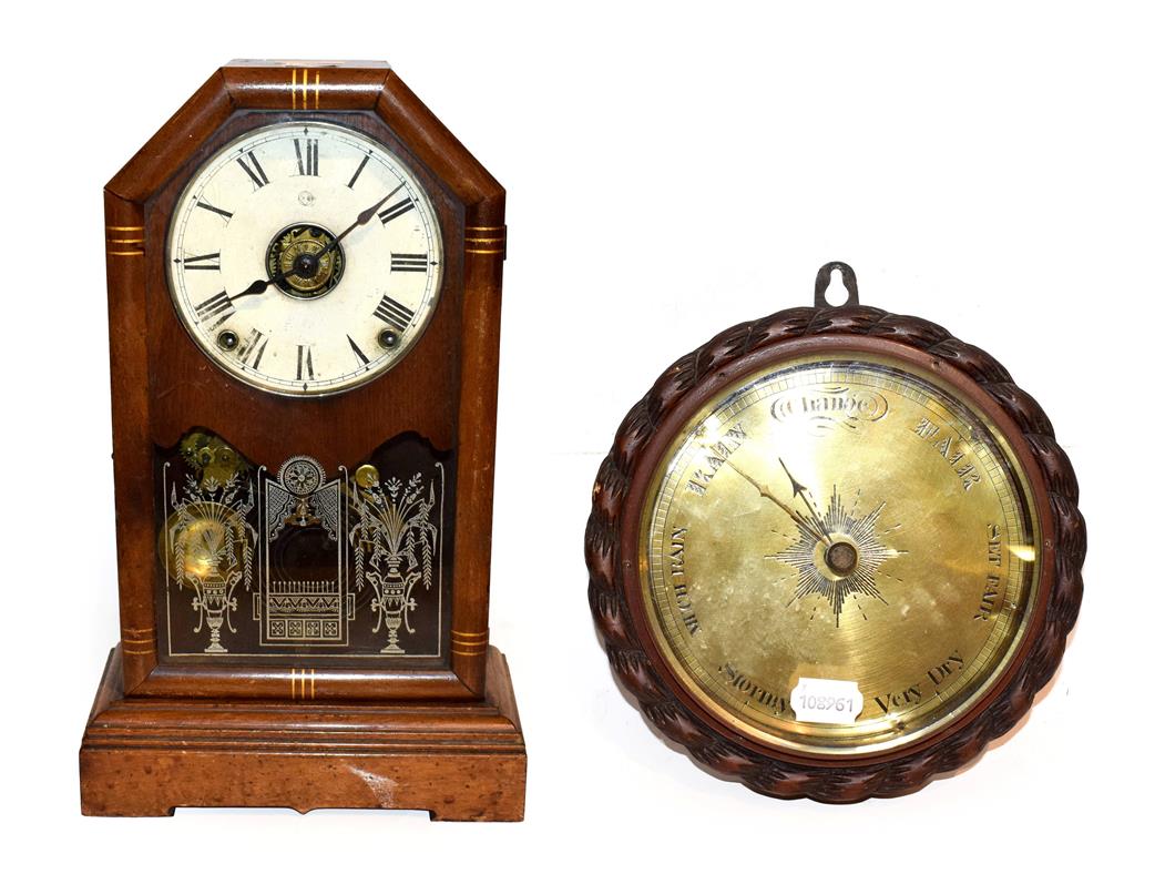 Lot 29 - A Seth Thomas mantel clock with alarm function, together with an oak cased wheel barometer with...