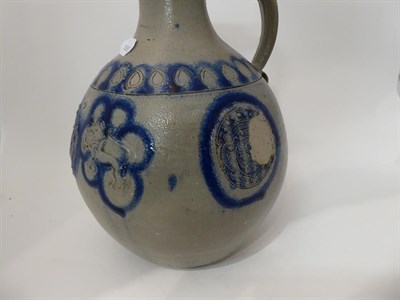 Lot 45 - Two 18th century German Westerwald salt glazed stoneware flagons, one with a Royal monogram GR, the