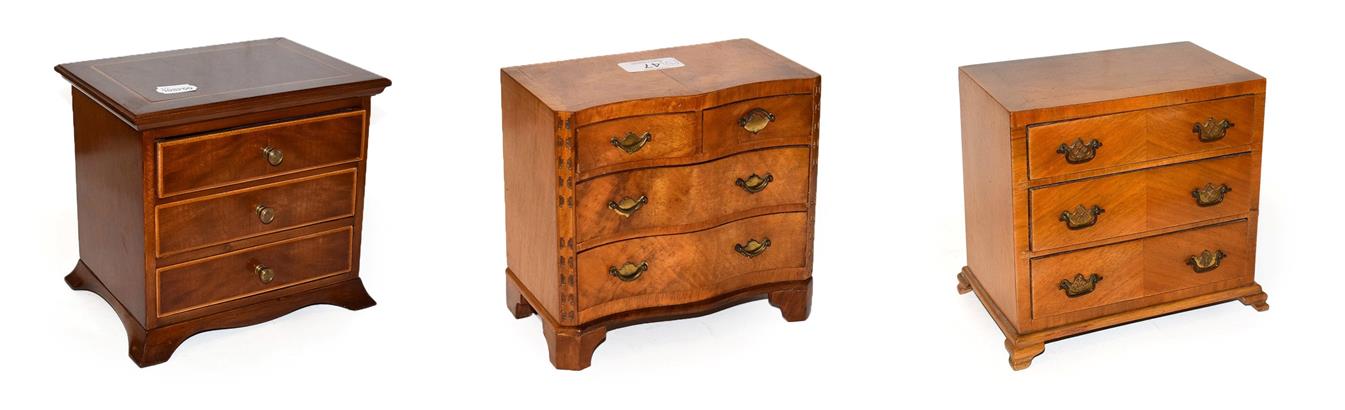 Lot 47 - A walnut jewellery casket formed as a serpentine chest of drawers, crossbanded in mahogany,...