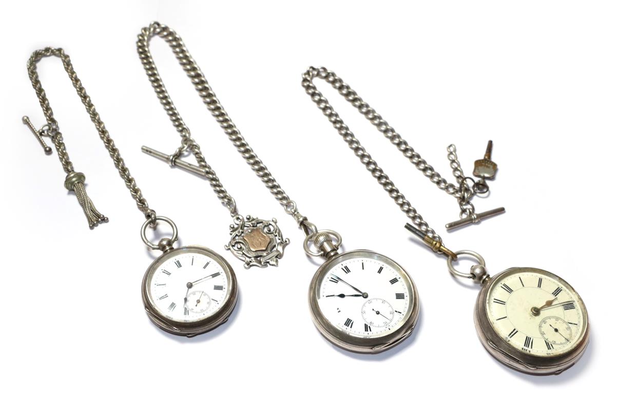 Lot 54 - Three silver open faced pocket watches, with two attached silver curb link chains and attached...