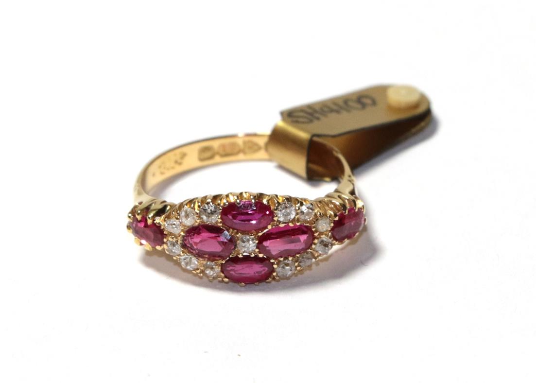 Lot 59 - An 18 carat gold synthetic ruby and diamond cluster ring, four oval cut synthetic rubies with...