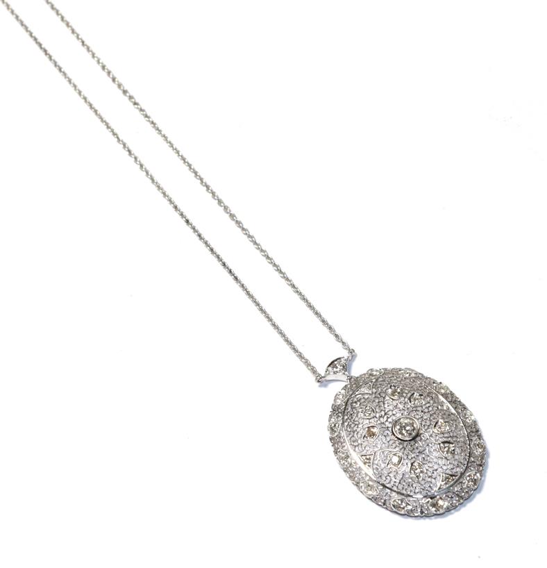 Lot 63 - A diamond pendant necklace, the white oval filigree pendant set throughout with round brilliant cut