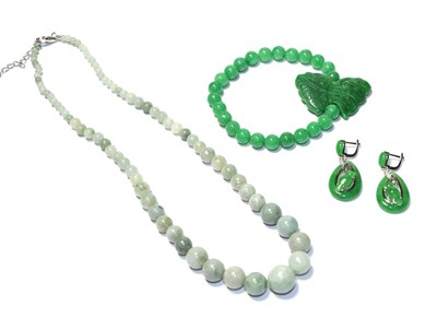 Lot 65 - A graduated jadeite necklace, clasp stamped '925', length 47cm, an elasticated jadeite bracelet and
